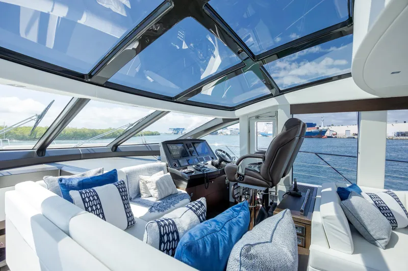 Slide: The Image of Luxurious interior of 2020 Sunseeker Predator 74 XPS yacht with panoramic windows and plush seating. - 87