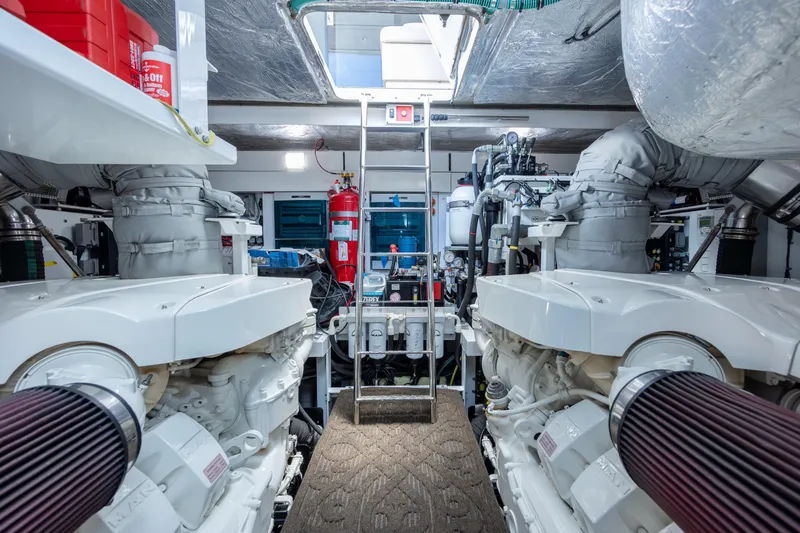 Slide: The Image of Engine room of 2020 Sunseeker Predator 74 XPS yacht, featuring dual engines and equipment. - 9