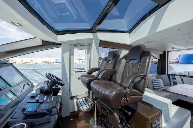 Slide: The Image of Luxurious interior of 2020 Sunseeker Predator 74 XPS yacht with leather seating and panoramic windows. - 90