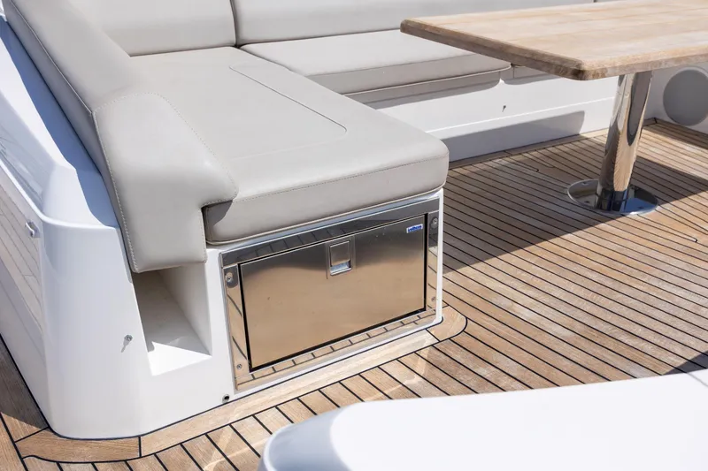 Slide: The Image of Luxury Sunseeker Predator 74 XPS yacht deck with seating and wooden table, 2020 model. - 95