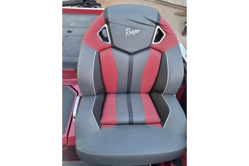 Slide: The Image of 2024 Ranger Z520R Cup-Equipped boat seat, red and gray design, premium comfort. - 12