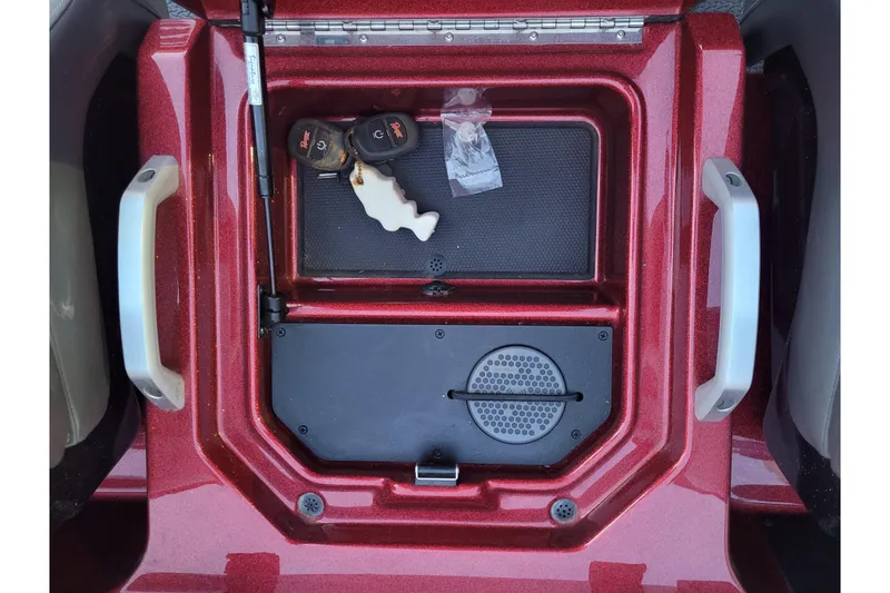 Slide: The Image of 2024 Ranger Z520R Cup-Equipped boat storage compartment with keys and accessories. - 14