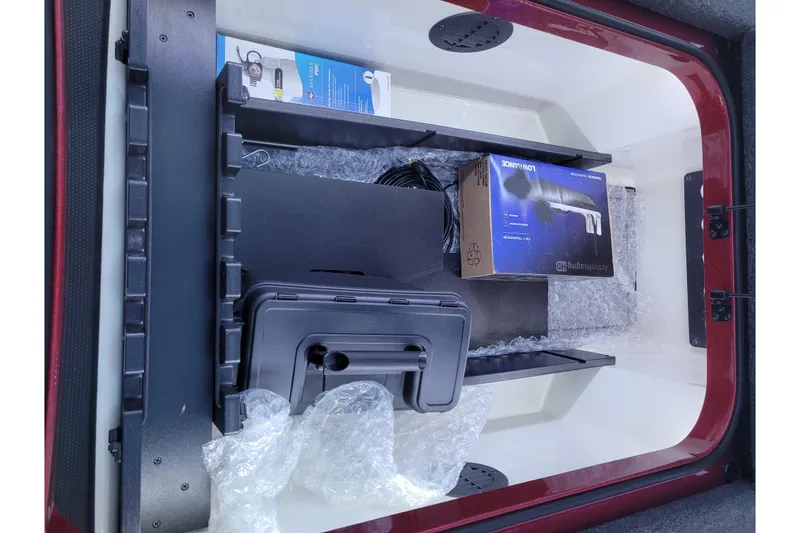 Slide: The Image of Storage compartment of 2024 Ranger Z520R Cup-Equipped boat with accessories and packaging. - 18