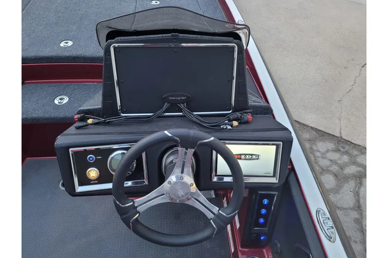 Slide: The Image of 2024 Ranger Z520R Cup-Equipped boat dashboard with steering wheel and electronic displays. - 23