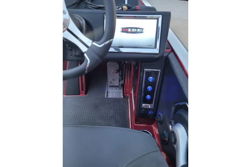 Slide: The Image of 2024 Ranger Z520R Cup-Equipped dashboard with steering wheel and control panel. - 24