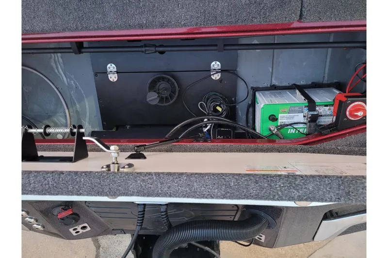 Slide: The Image of 2024 Ranger Z520R Cup-Equipped boat interior showing battery compartment and wiring setup. - 7