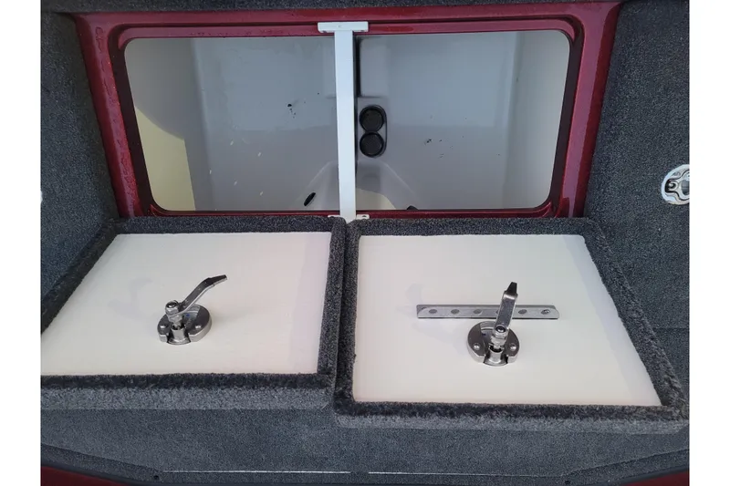 Slide: The Image of 2024 Ranger Z520R Cup-Equipped boat storage compartments with secure latches and red trim. - 9