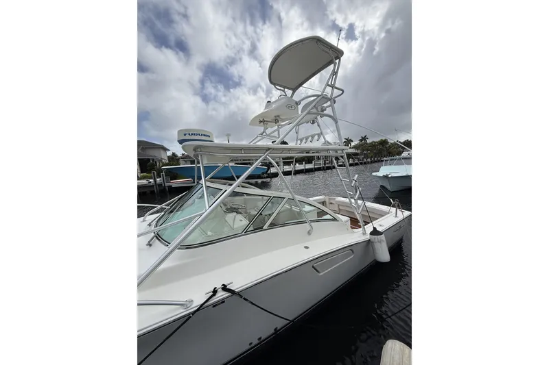 Slide: The Image of 2005 Albemarle 30 Express boat docked, featuring a tower and Furuno radar. - 14