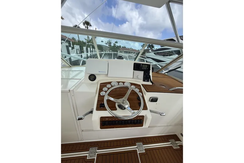 Slide: The Image of Helm of 2005 Albemarle 30 Express boat with steering wheel and gauges. - 16