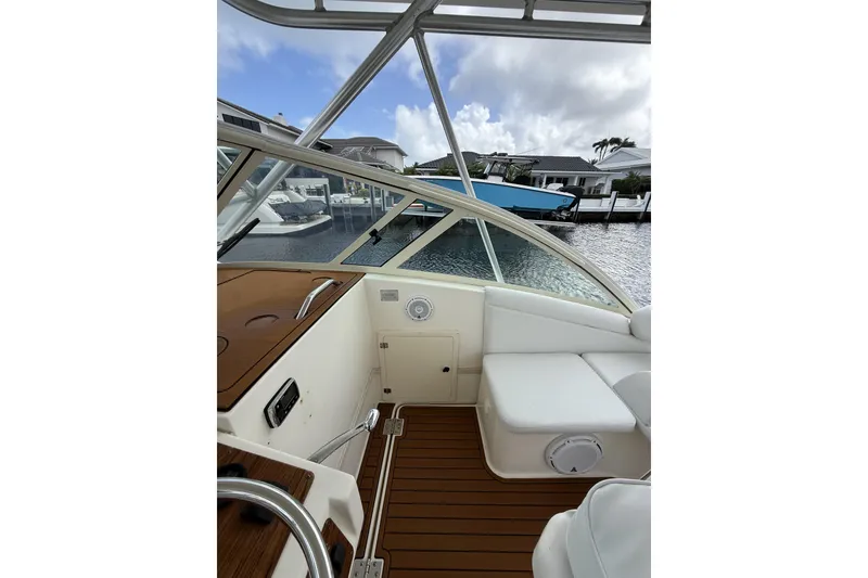 Slide: The Image of 2005 Albemarle 30 Express boat interior with seating and wooden flooring. - 17