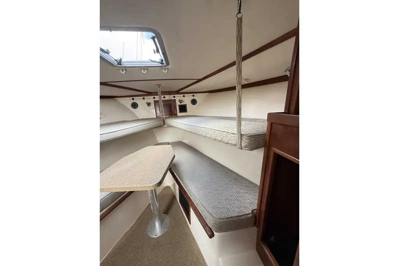 Slide: The Image of Interior of 2005 Albemarle 30 Express boat with seating and table. - 24