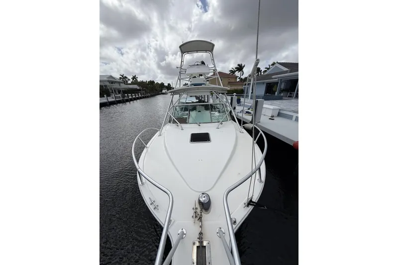 Slide: The Image of 2005 Albemarle 30 Express boat docked on a cloudy day. - 7