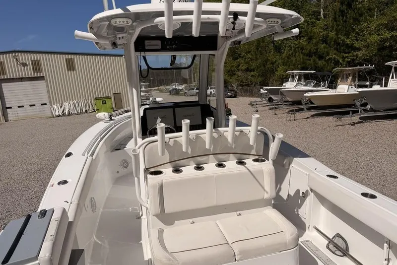 Slide: The Image of 2021 Sea Hunt Gamefish 27 boat with forward seating, docked outdoors. - 4