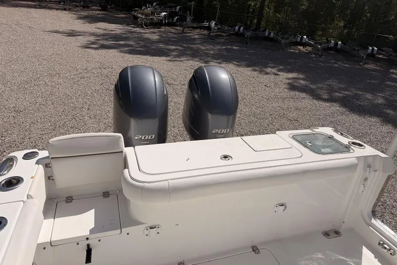 Slide: The Image of 2021 Sea Hunt Gamefish 27 boat with dual 200 horsepower engines, rear seating view. - 5