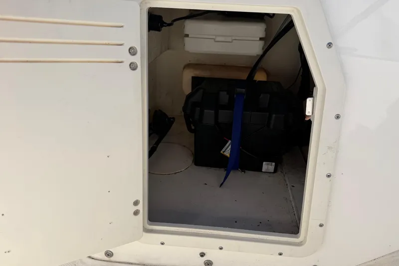 Slide: The Image of Open storage compartment on a 2015 Boston Whaler 170 Montauk boat. - 10