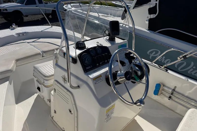 Slide: The Image of 2015 Boston Whaler 170 Montauk boat console with steering wheel and gauges. - 11