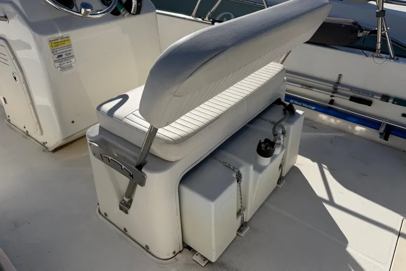 Slide: The Image of 2015 Boston Whaler 170 Montauk boat interior with seating and storage. - 13