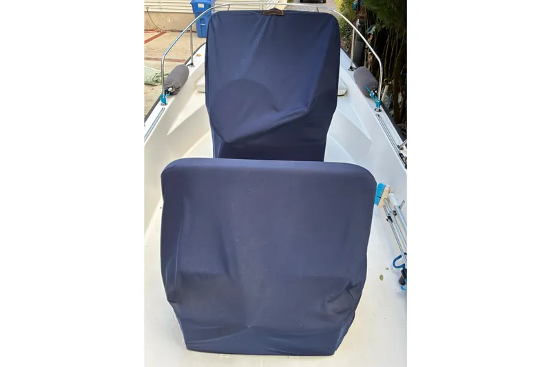 Slide: The Image of 2015 Boston Whaler 170 Montauk boat with Mercury outboard motor on trailer. - 4