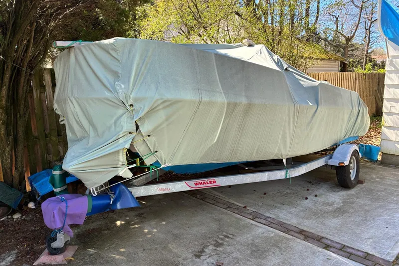 Slide: The Image of 2015 Boston Whaler 170 Montauk boat seats covered with blue fabric. - 5