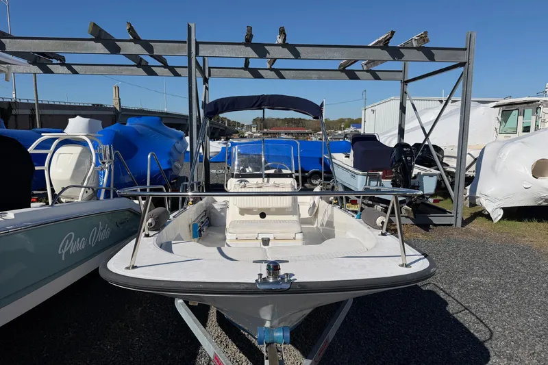 Slide: The Image of 2015 Boston Whaler 170 Montauk boat in storage yard, surrounded by other boats. - 8