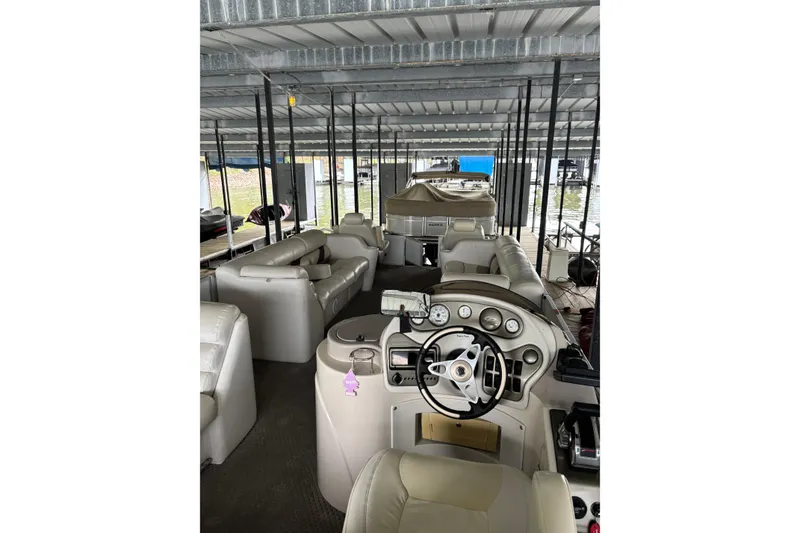 Slide: The Image of 2007 Crest 2570 III XRS pontoon boat interior with steering console and seating. - 11