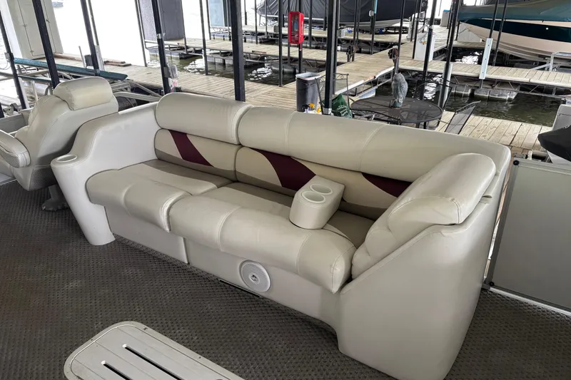 Slide: The Image of Luxurious seating on a 2007 Crest 2570 III XRS pontoon boat at a dock. - 13