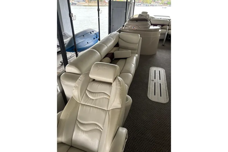 Slide: The Image of Luxurious interior of 2007 Crest 2570 III XRS boat with plush seating. - 17