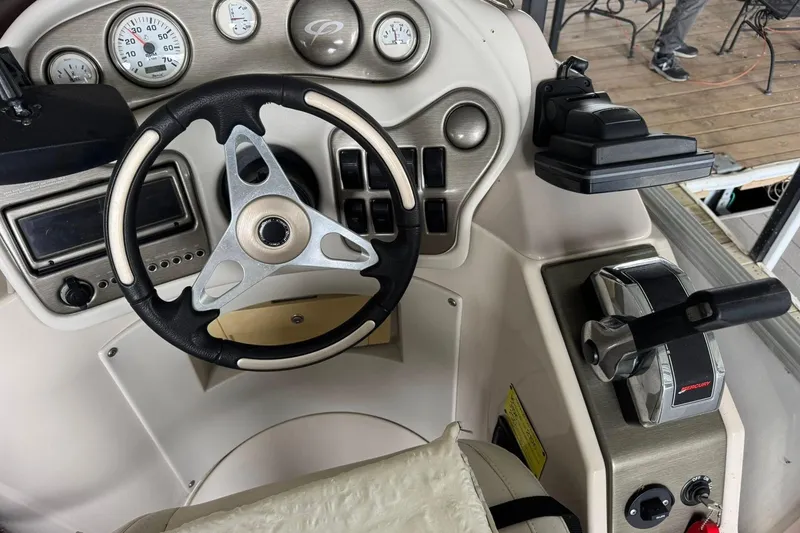 Slide: The Image of Steering console of a 2007 Crest 2570 III XRS boat with gauges and controls. - 8