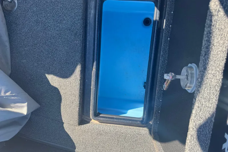 Slide: The Image of Interior view of a 2021 Nitro ZV19 Sport boat compartment with blue lining. - 15