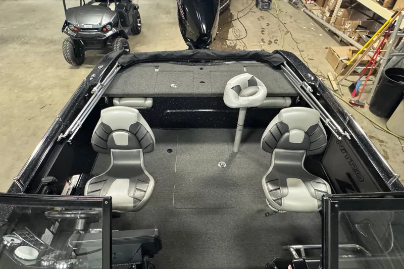 Slide: The Image of 2021 Nitro ZV19 Sport boat interior with gray seating and spacious layout. - 17