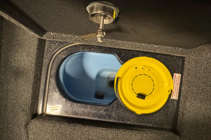 Slide: The Image of 2021 Nitro ZV19 Sport livewell with yellow lid and pump-out feature. - 18