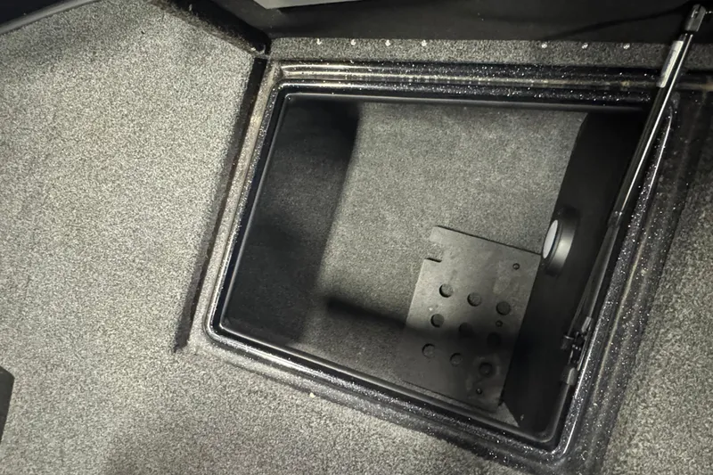 Slide: The Image of Open storage compartment in 2021 Nitro ZV19 Sport boat, featuring carpeted interior. - 19