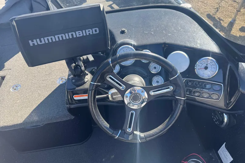 Slide: The Image of 2021 Nitro ZV19 Sport dashboard with Humminbird display and steering wheel. - 6