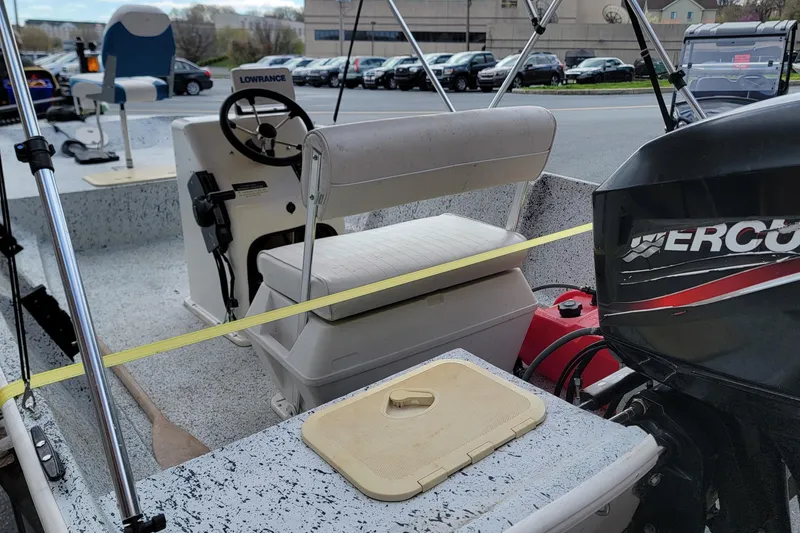 Slide: The Image of Interior of a 2021 HORIZEN CS 170 CC boat with steering wheel and motor. - 7