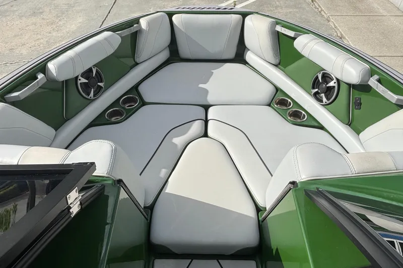 Slide: The Image of Interior of 2021 Malibu Wakesetter 21 VLX boat with green and white seating. - 8