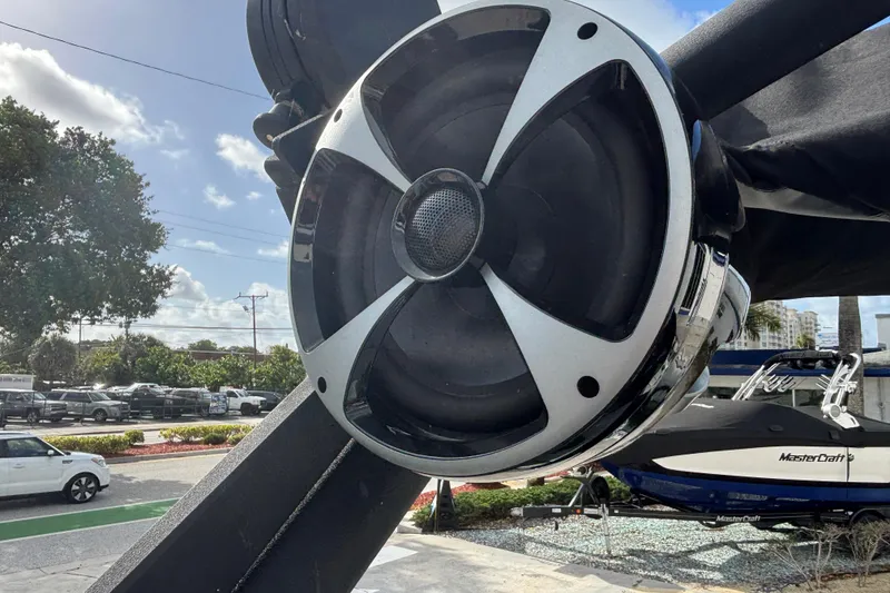 Slide: The Image of Close-up of a speaker on a 2021 Malibu Wakesetter 21 VLX boat. - 9