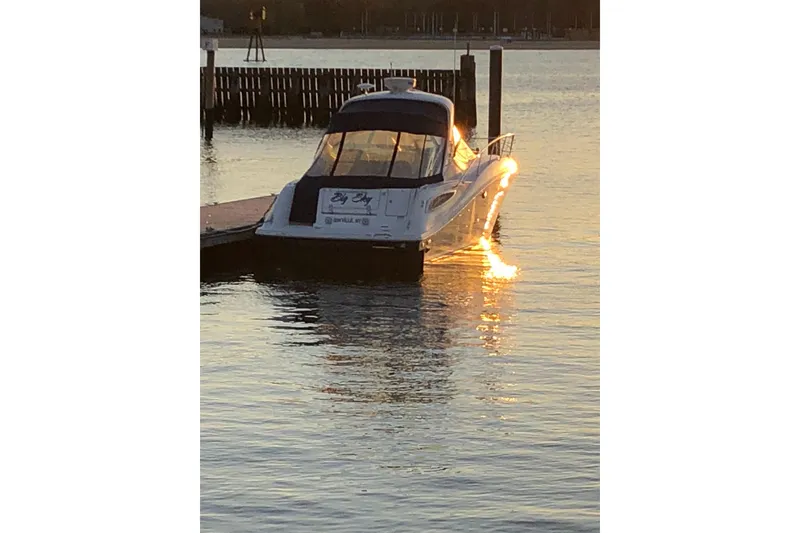 Slide: The Image of Sea Ray Sundancer 350 yacht docked at sunset, 2012 model. - 4