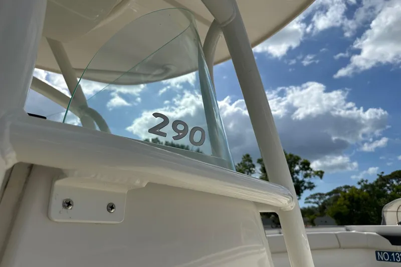 Slide: The Image of 2022 Sailfish 290 CC boat detail against a cloudy sky backdrop. - 11