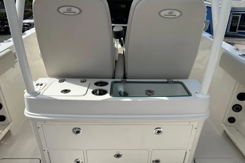 Slide: The Image of 2022 Sailfish 290 CC boat interior with seating and storage compartments. - 28