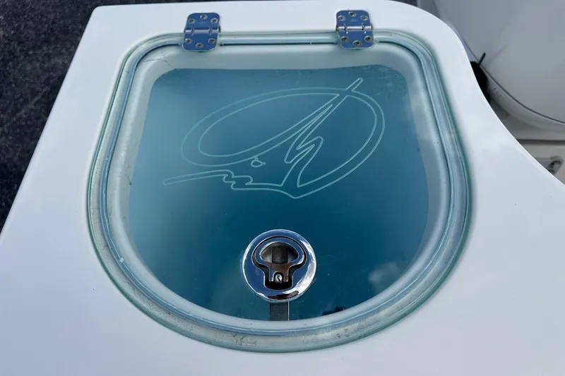Slide: The Image of Livewell hatch on 2022 Sailfish 290 CC boat with etched logo and secure latch. - 35