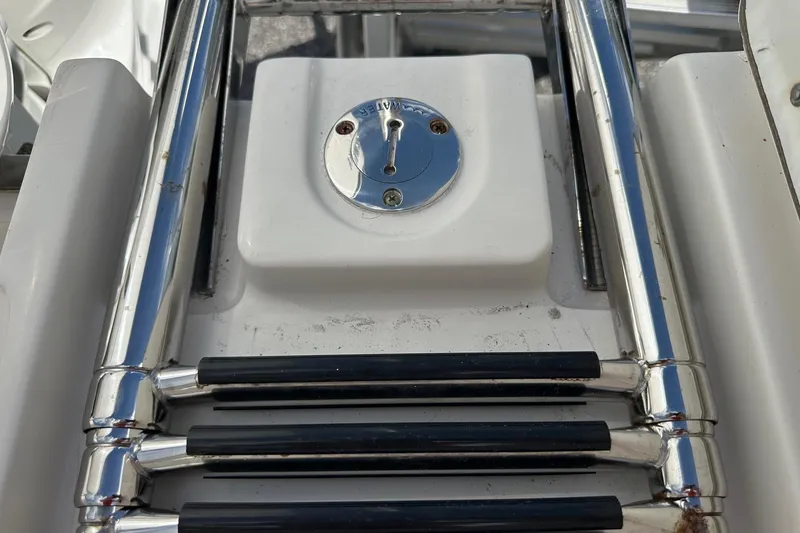 Slide: The Image of Stainless steel ladder on 2022 Sailfish 290 CC boat deck. - 40