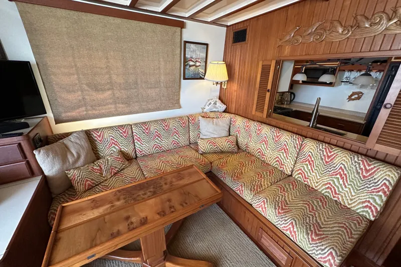 Slide: The Image of Cozy 1987 Kadey-Krogen Manatee 36 interior with patterned seating and wooden accents. - 10