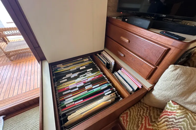 Slide: The Image of Filing cabinet with organized folders inside Kadey-Krogen Manatee 36, 1987 model. - 14