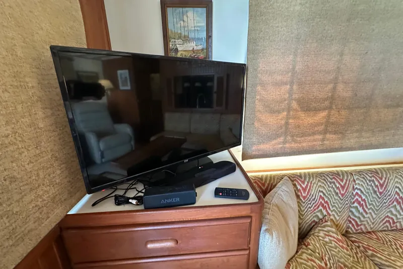 Slide: The Image of Television setup in 1987 Kadey-Krogen Manatee 36 yacht interior, featuring Anker speaker. - 15