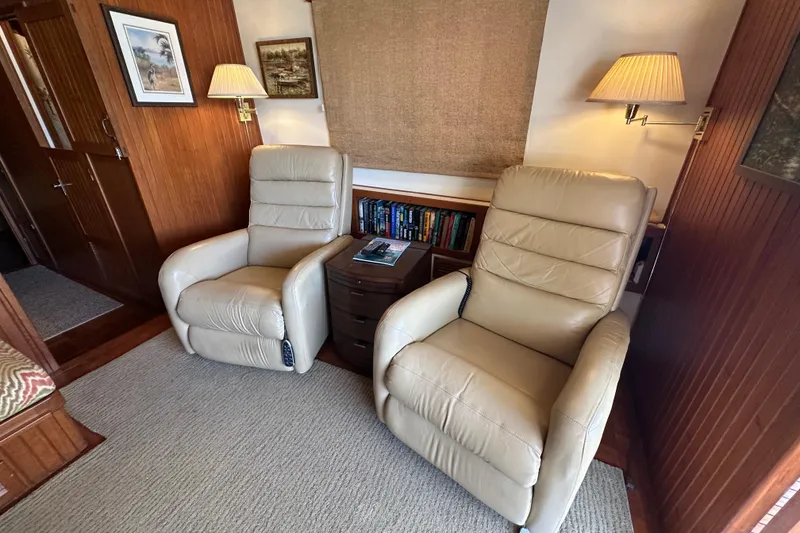 Slide: The Image of Cozy interior of 1987 Kadey-Krogen Manatee 36 with beige recliners and wooden accents. - 16