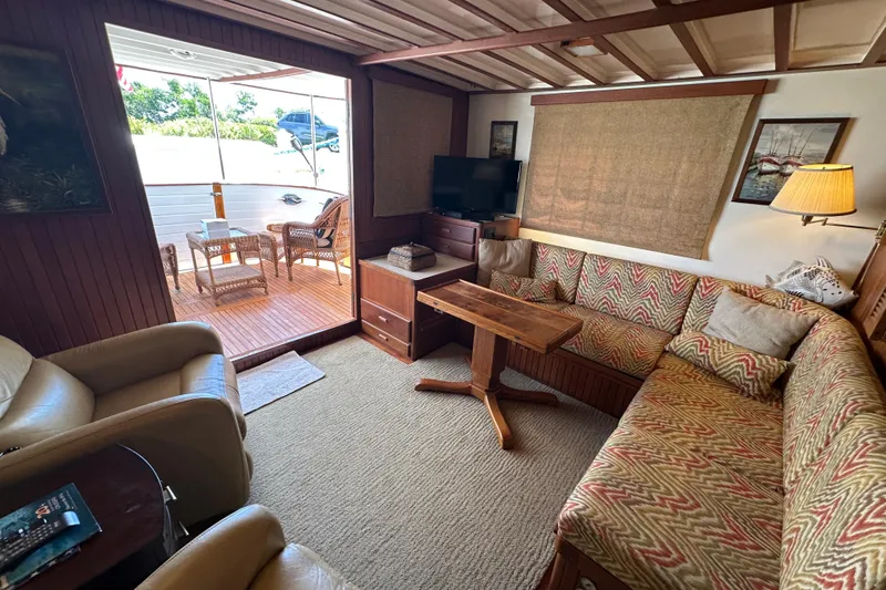 Slide: The Image of Cozy interior of 1987 Kadey-Krogen Manatee 36 yacht with seating and outdoor deck. - 17