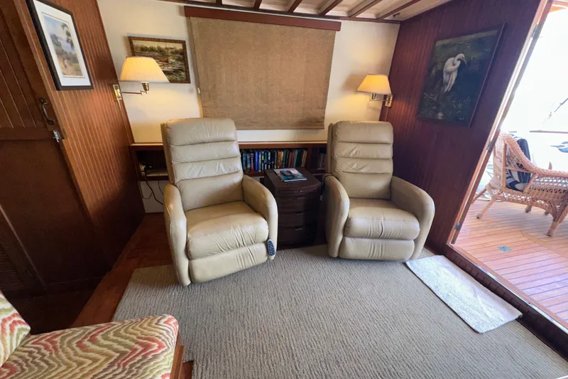 Slide: The Image of Interior of 1987 Kadey-Krogen Manatee 36 with beige recliners and wooden accents. - 20