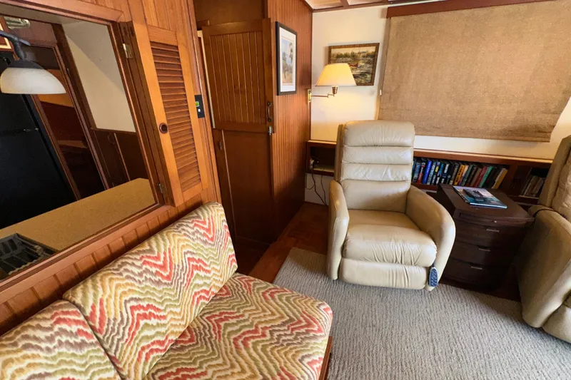 Slide: The Image of Interior of 1987 Kadey-Krogen Manatee 36 with cozy seating and wooden accents. - 21