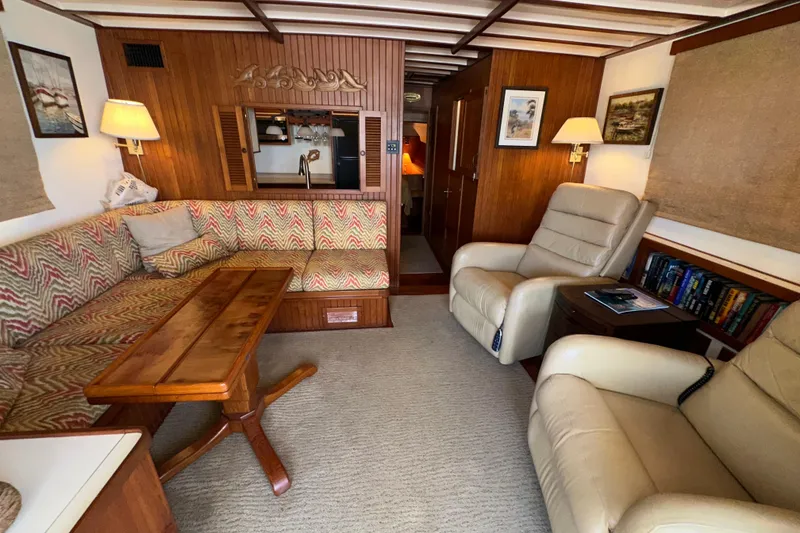 Slide: The Image of Cozy interior of 1987 Kadey-Krogen Manatee 36 yacht with plush seating and wooden accents. - 23
