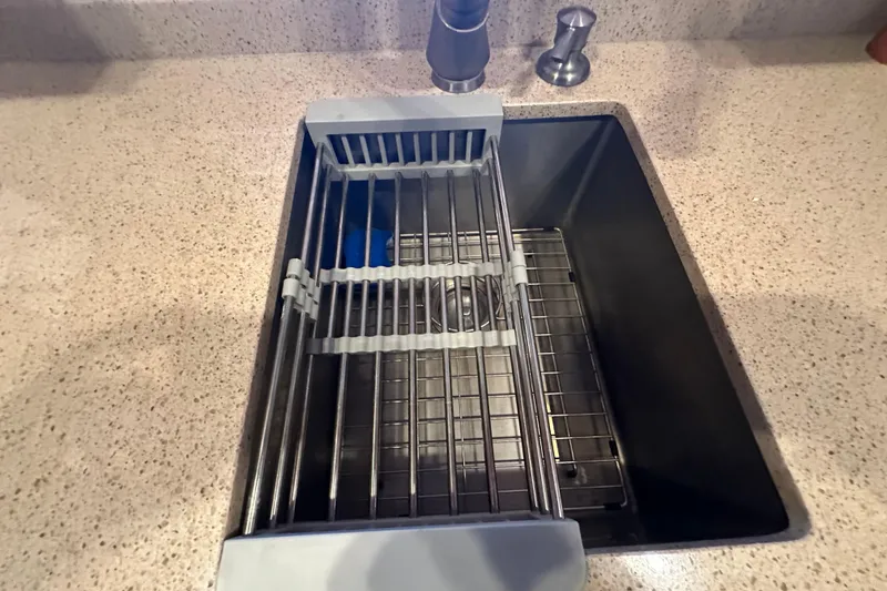 Slide: The Image of Kitchen sink with drying rack on Kadey-Krogen Manatee 36, 1987 model. - 32